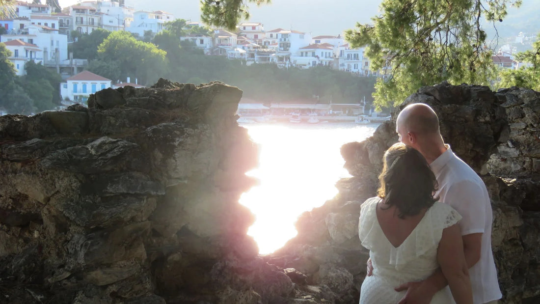 A couple on their wedding day looking out over the ocean on Skiathos island. 