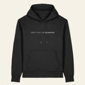 Front view of the black Best Human Beaming heavyweight unisex hoodie with white chest logo, drawcords and kangaroo pocket.