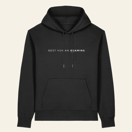 Front view of the black Best Human Beaming heavyweight unisex hoodie with white chest logo, drawcords and kangaroo pocket.